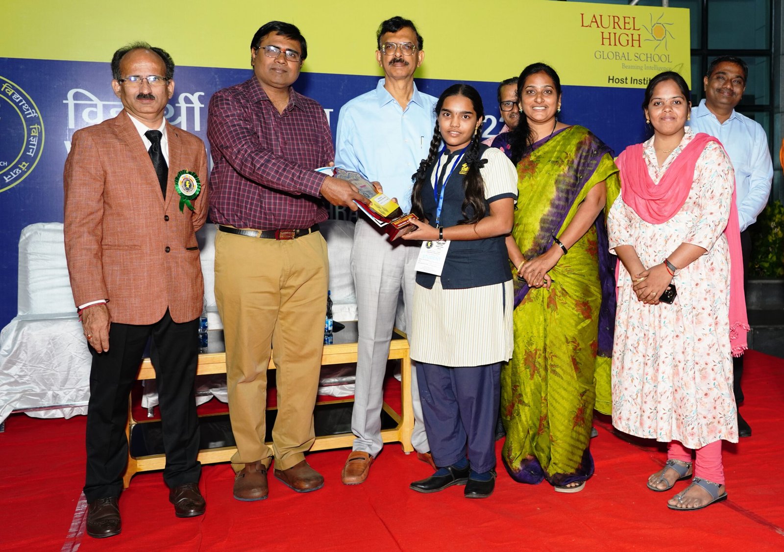 Saiteja Vidyaniketan student receiving recognition at an award ceremony
