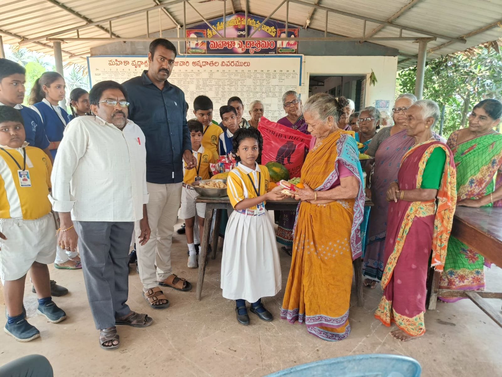 Saiteja Vidyaniketan students participating in an activity with elderly community members